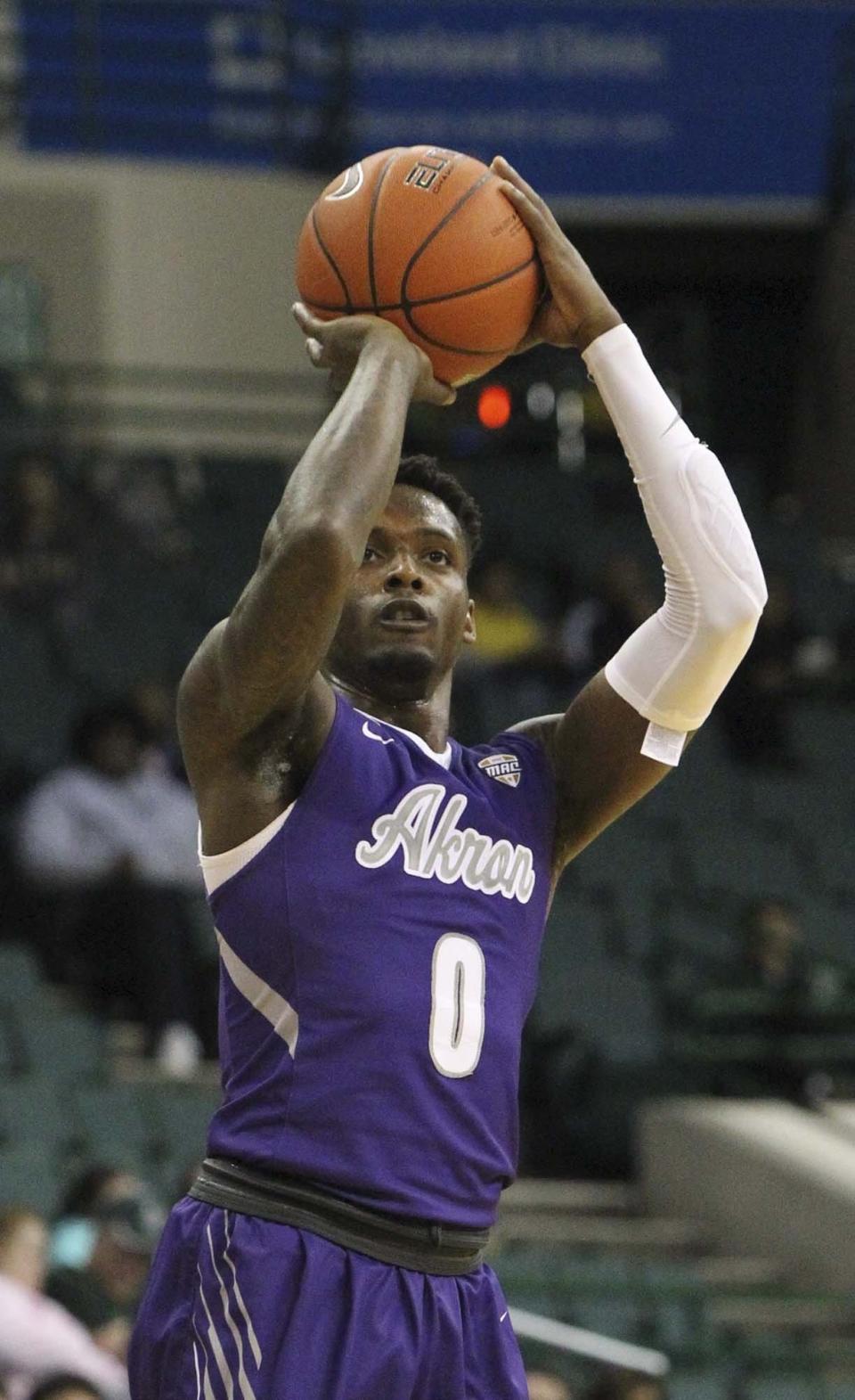 Akron's Jimond Ivey makes a 3-pointer against Youngstown State at the Wolstein Center, Saturday, Nov. 10, 2018 in Cleveland.