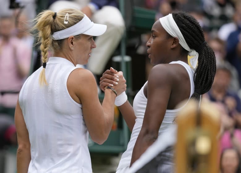 Germany's Angelique Kerber, left, greets Coco Gauff of the U.S. after winning the women's singles fourth round match