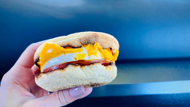 hand holding Egg McMuffin