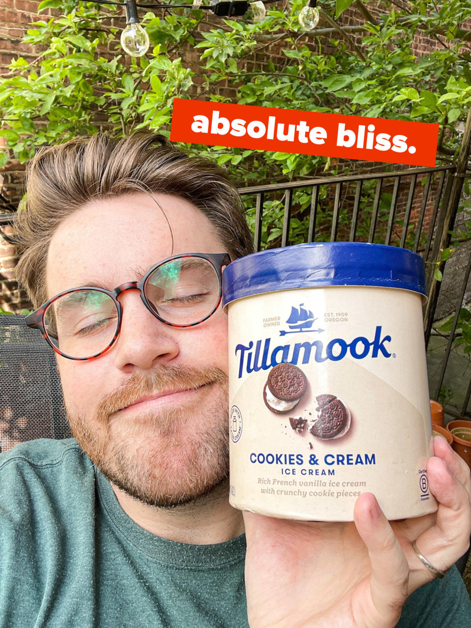 Ross holds a pint of Tillamook ice cream with text. that reads "absolute bliss."