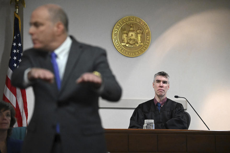 Washington County Judge Adam Michelini, right, listens to opening statements from defense attorney Arthur Frost, left, in Kevin Monahan's murder trial, Thursday, Jan. 11, 2024, at the Washington County Courthouse in Fort Edward, N.Y. Monahan, 66, is accused of fatally shooting 20-year-old Kaylin Gillis on the night of April 15, 2023, after she and friends accidentally pulled into his driveway in rural Hebron. He is charged with second-degree murder, reckless endangerment and tampering with physical evidence. (Will Waldron/The Albany Times Union via AP, Pool)