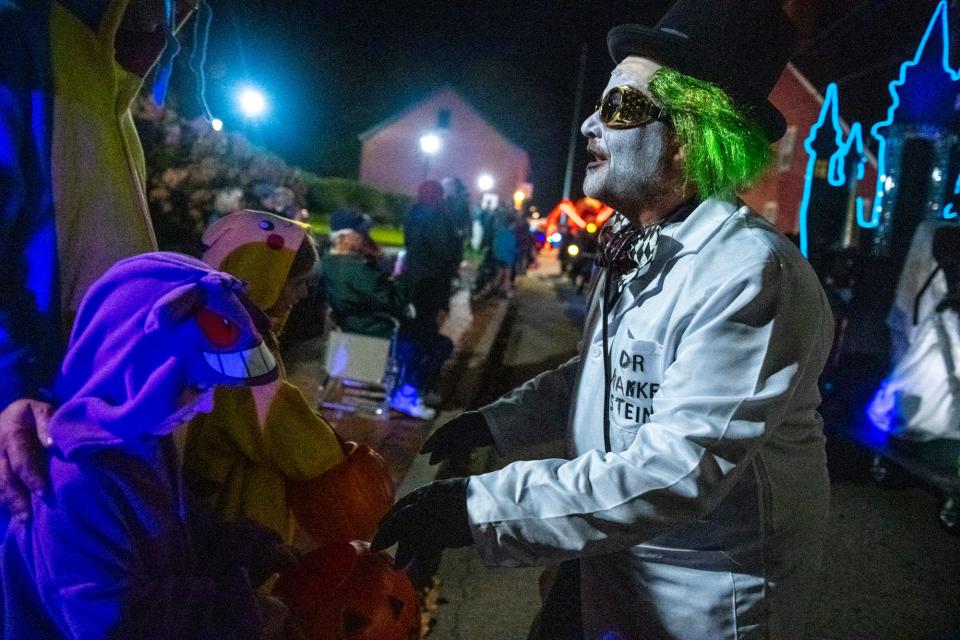 People gather to watch and participate in the 26th Portsmouth Halloween Parade Sunday, Oct. 31, 2021.