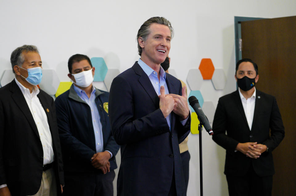 Governor Gavin Newsom spoke with news reporters about San Diego's newest pop-up vaccination site at the Park de la Cruz Recreation Center in the City Heights neighborhood on Friday, April 2, 2021 in San Diego. Accompanying Newsom was Juan Vargas, Ben Hueso, Sean Elo-Rivera and Todd Gloria. (Nelvin C. Cepeda/The San Diego Union-Tribune via AP)