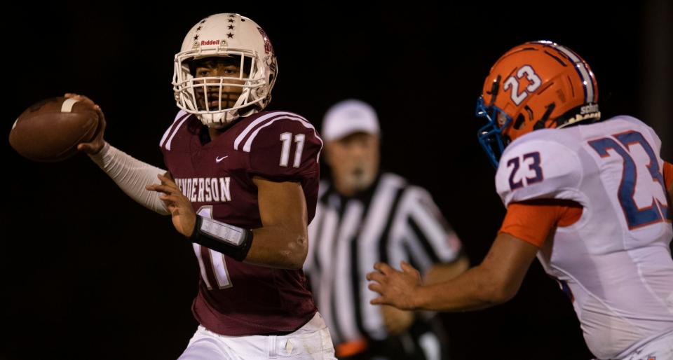 Henderson County's Trajdon Davis (11) looks for a pass as the Henderson County Colonels play the Marshall County Marshals at Henderson County High School in Henderson, Ky., Friday evening , Sept. 30, 2022.