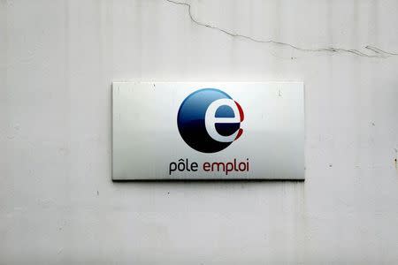 A logo is seen on the entrance of a Pole Emploi office (National Agency for Employment) in Champigny sur Marne, eastern Paris in this November 19, 2014 file photo. REUTERS/Charles Platiau/Files