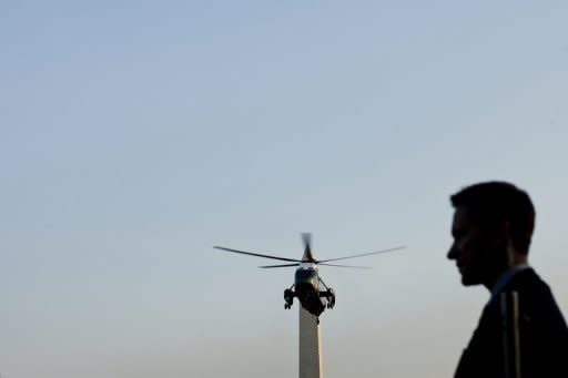 File picture shows a Secret Service keeping watch as Marine One passes the Washington Monument. The White House expressed confidence in the chief of the US Secret Service, as the elite bodyguard unit's Colombian sex scandal deepened, with claims that 20 women were involved