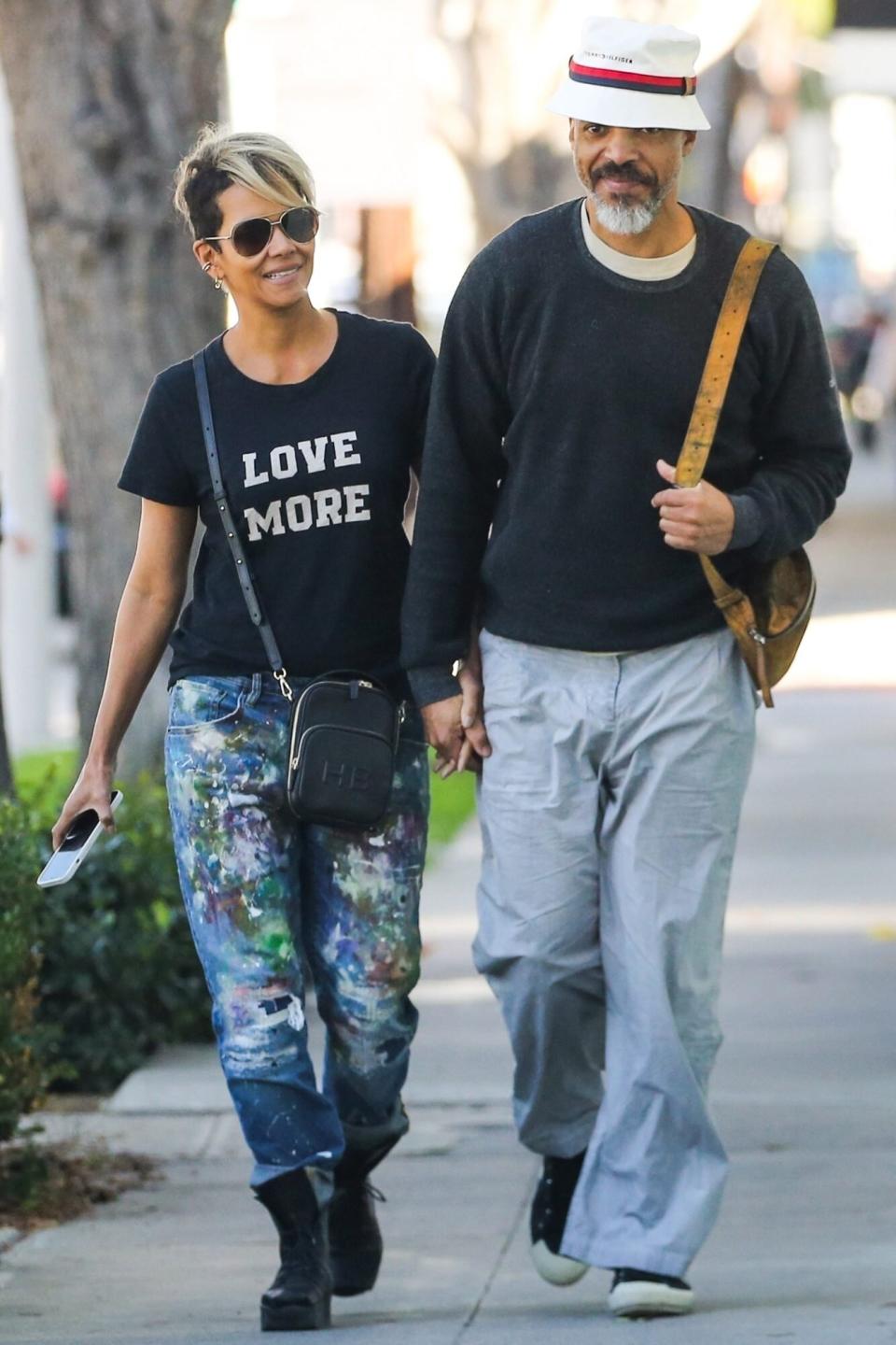 Los Angeles, CA - *EXCLUSIVE* - Oscar-winning actress Halle Berry and boyfriend Van Hunt are seen shopping for furniture in Los Angeles. Halle was all smiles and kept things casual in a black tee which read LOVE MORE paired with blue jeans during the outing with Van. Pictured: Hale Berry, Van Hunt BACKGRID USA 18 NOVEMBER 2022 BYLINE MUST READ: BACKGRID USA: +1 310 798 9111 / usasales@backgrid.com UK: +44 208 344 2007 / uksales@backgrid.com *UK Clients - Pictures Containing Children Please Pixelate Face Prior To Publication*