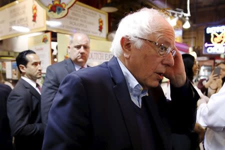 U.S. Democratic presidential candidate Bernie Sanders wipes his brow as he greets voters at the Reading Terminal Market on primary election day in Philadelphia, Pennsylvania, U.S., April 26, 2016. REUTERS/Dominick Reuter