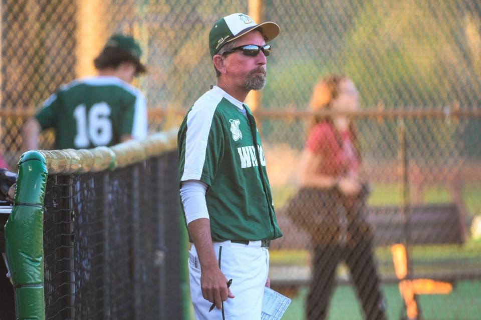 Jupiter head coach Andy Mook watches the action on the field during the varsity baseball game between host Jupiter and Dwyer in Jupiter, FL., on Monday, March 28, 2022. Final score, Jupiter, 3, Dwyer, 1.