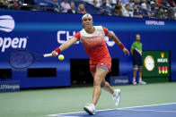 Ons Jabeur, of Tunisia, returns a shot to Ajla Tomljanovic, of Austrailia, during the quarterfinals of the U.S. Open tennis championships, Tuesday, Sept. 6, 2022, in New York. (AP Photo/Julia Nikhinson)