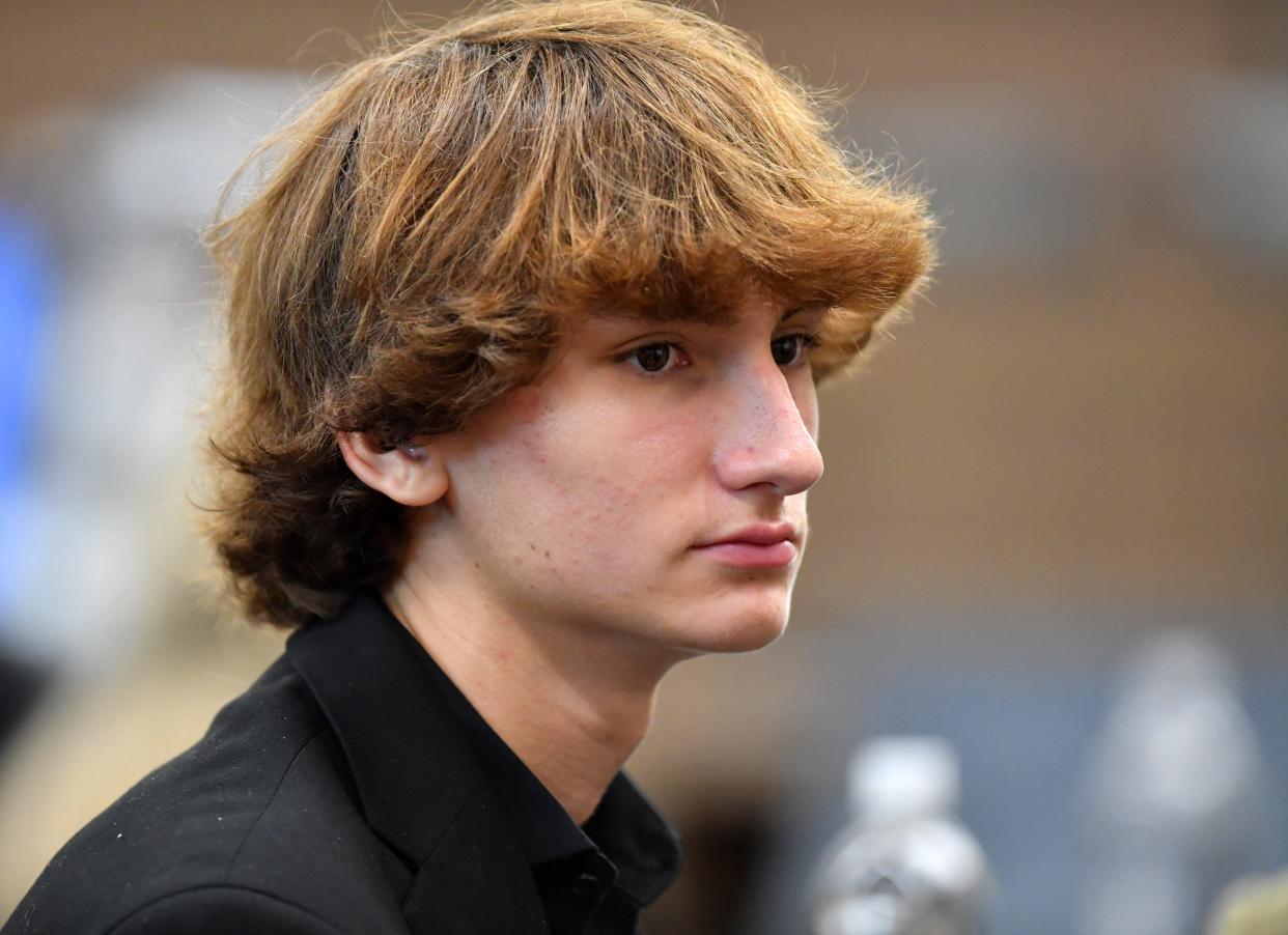 Kyle Kowalski speaks with his father, Jack Kowalski in court Wednesday, Oct. 4, 2023 at the South County Courthouse in Venice, Florida. The Kowalski family is suing Johns Hopkins All Children's Hospital for false imprisonment, negligent infliction of emotional distress, medical negligence, battery, and other claims more than a year after the family matriarch, Beata Kowalski, took her life following allegations she was abusing her daughter, Maya Kowalski. Pool photo/Mike Lang/Sarasota Herald-Tribune