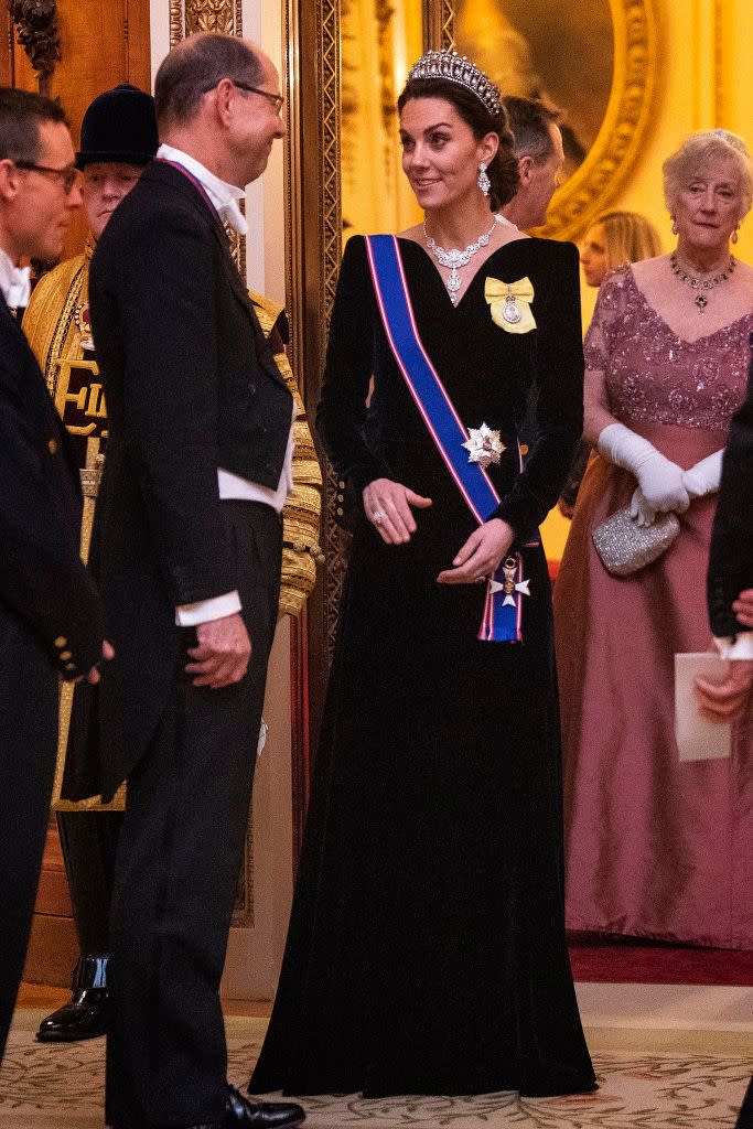 <p>Kate Middleton pulled out her best formal attire for a diplomatic reception at Buckingham Palace. The Duchess wore a <a href="https://www.townandcountrymag.com/society/tradition/a30170423/kate-middleton-royal-family-order-gvco-sash-diplomatic-reception-2019/" rel="nofollow noopener" target="_blank" data-ylk="slk:blue sash and yellow pin to the event;elm:context_link;itc:0;sec:content-canvas" class="link ">blue sash and yellow pin to the event</a>, which were her newly granted royal orders. The items were bestowed upon her by the Queen when she was granted the Dame Grand Cross of the Royal Victorian Order.</p>