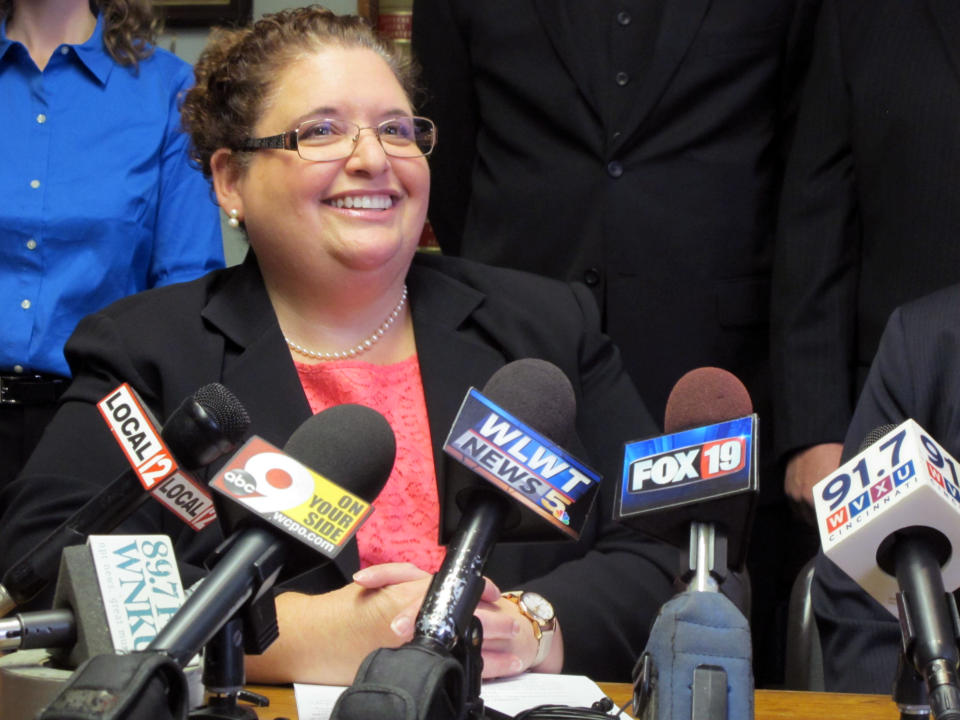 In this Wednesday, April 30, 2014, photo, civil rights attorney Jennifer Branch talks to media in Cincinnati on Wednesday, April 30, 2014. Branch filed a lawsuit on behalf of six gay couples living in southwestern Ohio who say they are in love and want to get married. (AP Photo/Amanda Lee Myers)