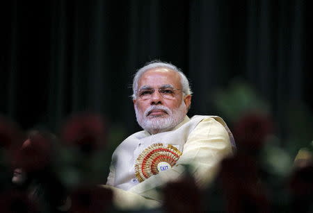 Hindu nationalist Narendra Modi, then-prime ministerial candidate for India's main opposition Bharatiya Janata Party (BJP) and Gujarat's chief minister, attends the Confederation of All India Traders (CAIT) national convention in New Delhi, India, in this February 27, 2014 file photo. REUTERS/Stringer/Files