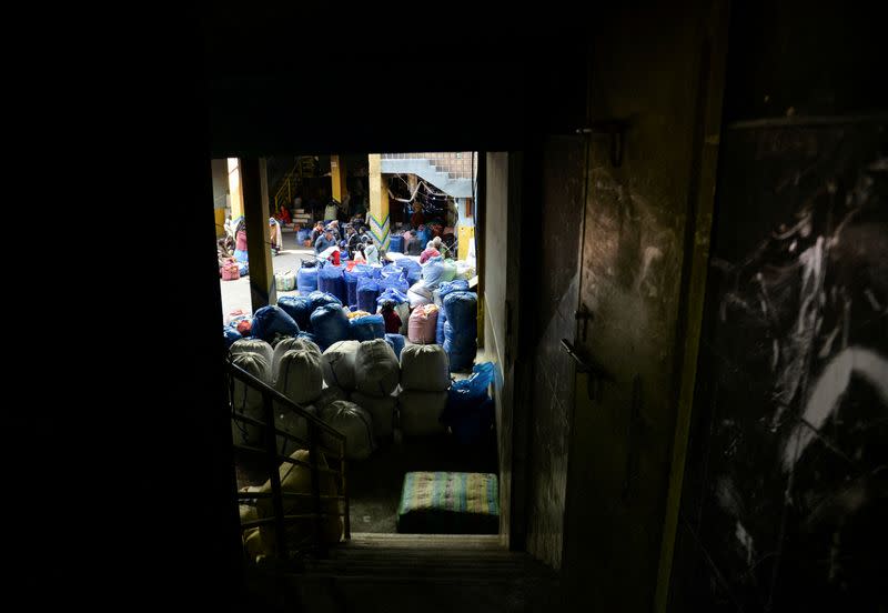 FILE PHOTO: Coca growers wait for customers during the reopening of the coca market of the Departmental Association of Coca Producers (ADEPCOCA), in La Paz