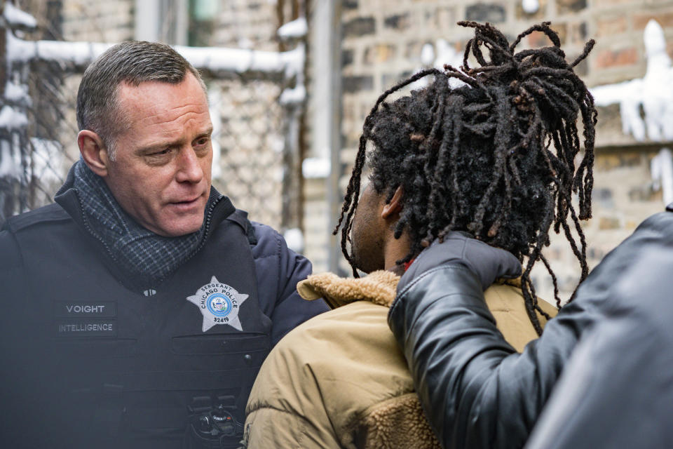 In this image released by NBC, Jason Beghe portrays Hank Voight, left, in a scene from the crime series "Chicago PD." The May 25 killing of George Floyd at the hands of Minneapolis police has set off protests worldwide and transmitted images of law enforcement that long remained far outside the narratives of crime stories. (Matt Dinerstein/NBC via AP)
