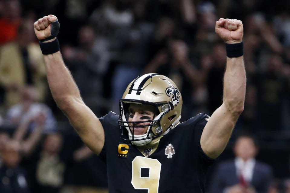 New Orleans Saints quarterback Drew Brees (9) celebrates his touchdown pass to tight end Josh Hill, which broke the NFL record for career touchdown passes, surpassing Peyton Manning, in the second half of an NFL football game against the Indianapolis Colts in New Orleans, Monday, Dec. 16, 2019. (AP Photo/Butch Dill)
