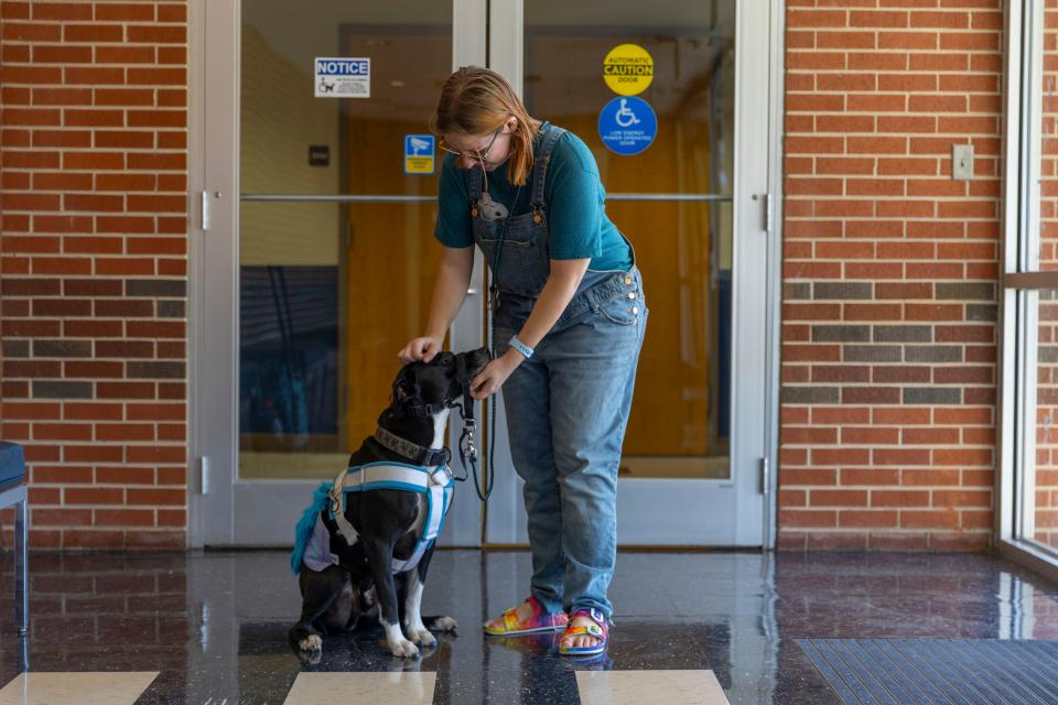 Vicky Evans stops for a moment with her service dog, Stryker Orion, on the campus of the University of Central Oklahoma in Edmond. Some businesses do not realize service dogs are permitted under federal law.