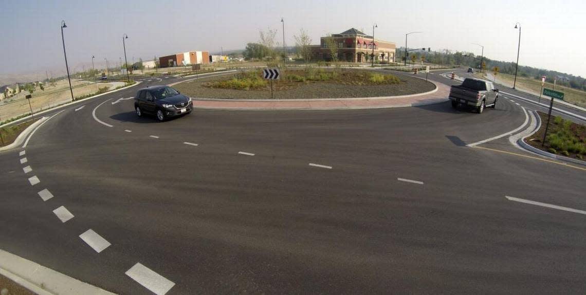 Traffic winds around one of two new roundabouts along E. ParkCenter Boulevard and Warm Springs Avenue in East Boise.