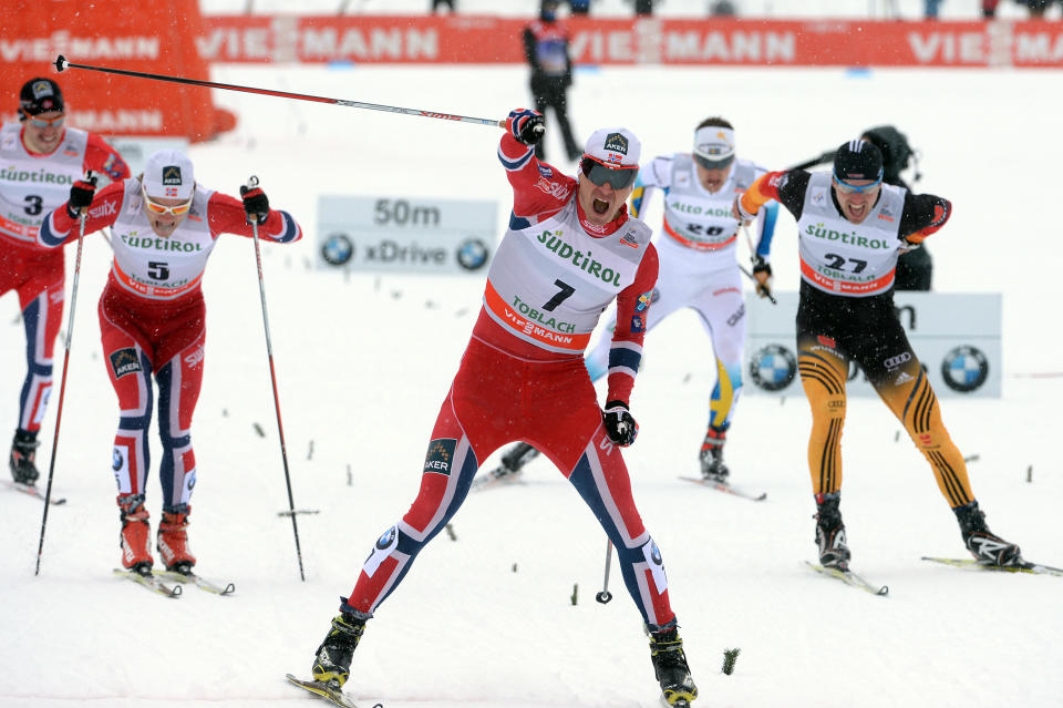 From left, second placed Eirik Brandsdal of Norway, winner Ola Vigen Hattestad of Norway and third placed Josef Wenzl of Germany, cross the finish line of a cross country men's World Cup sprint, in Dobbiaco, Italy, Sunday, Feb. 2, 2014. (AP Photo/Elvis Piazzi)