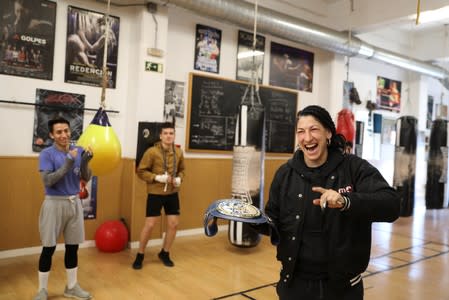 Miriam Gutierrez "La Reina", 36, reacts as fellow boxers congratulate her on winning the lightweight European Championship upon arriving at her boxing gym in Madrid