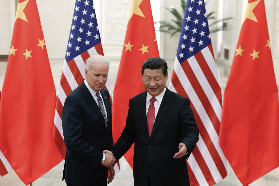 FILE - Chinese President Xi Jinping, right, shakes hands with Vice President Joe Biden as they pose for photos at the Great Hall of the People in Beijing, Dec. 4, 2013. As President Joe Biden and Xi Jinping prepare to hold their first summit on Monday, Nov. 15, the increasingly fractured U.S.-China relationship has demonstrated that the ability to connect on a personal level has its limits. Biden nonetheless believes there is value in a face-to-face meeting, even a virtual one like the two leaders will hold Monday evening. (AP Photo/Lintao Zhang, Pool, File)