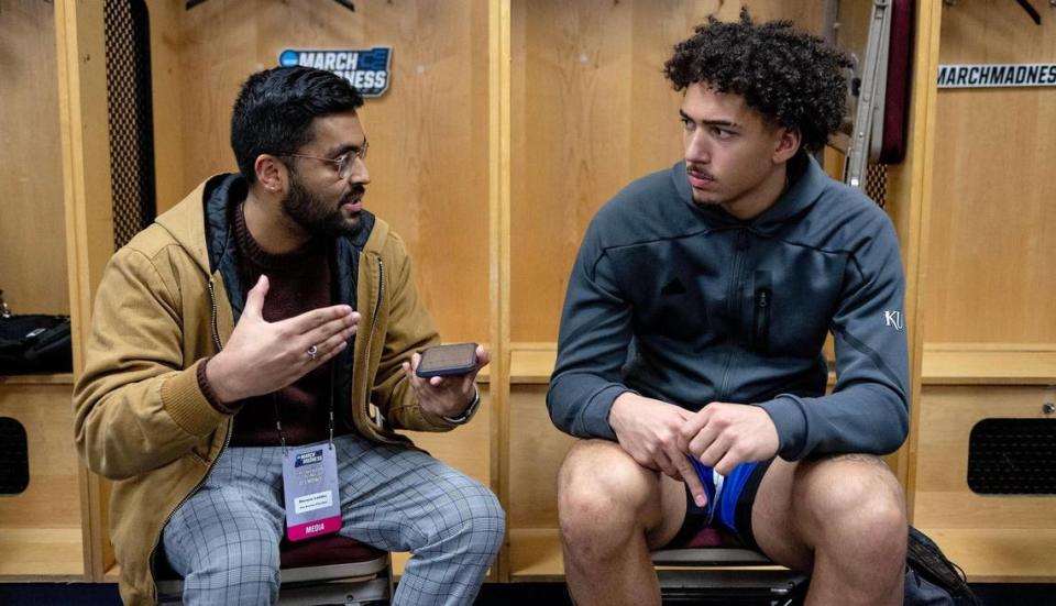 Kansas City Star sports reporter Shreyas Laddha, left, interviews University of Kansas basketball star Jalen Wilson after an NCAA tournament game.