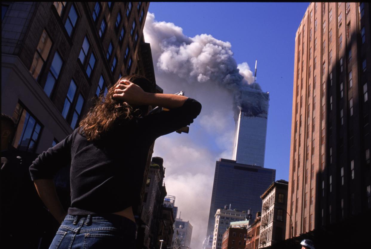 Shocked New Yorker Watches the World Trade Center on September 11, 2001