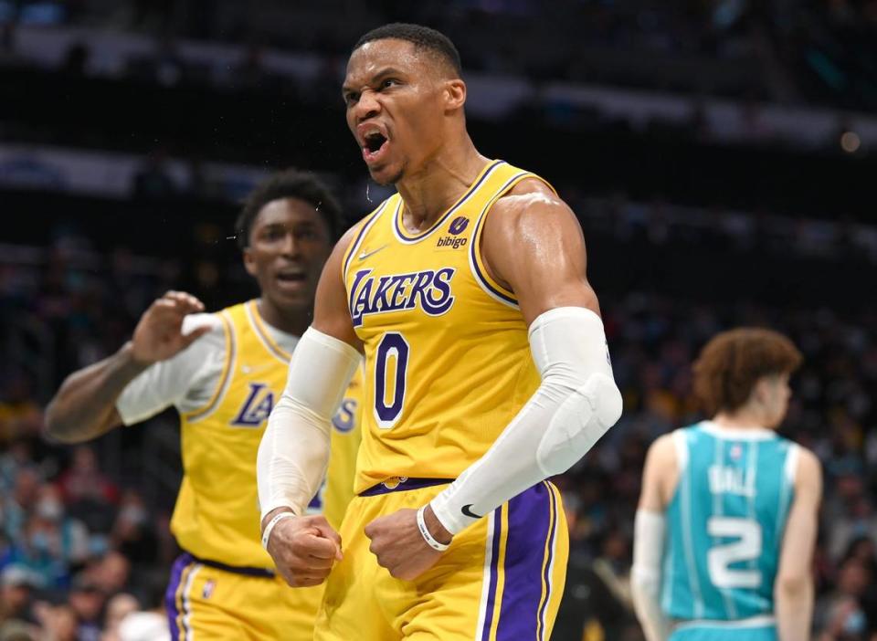 Los Angeles Lakers guard Russell Westbrook flexes following a basket against the Charlotte Hornets at Spectrum Center in Charlotte, NC on Friday, January 28, 2022. The Hornets defeated the Lakers 117-114. Westbrook, playing without teammates LeBron James and Anthony Davis, scored a game-high 35 points but missed a potential go-ahead three-pointer in the final seconds.