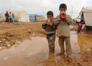 A million people were internally displaced by the Syrian conflict in 2014, such as these children at the Bab Al-Salama camp on the border with Turkey