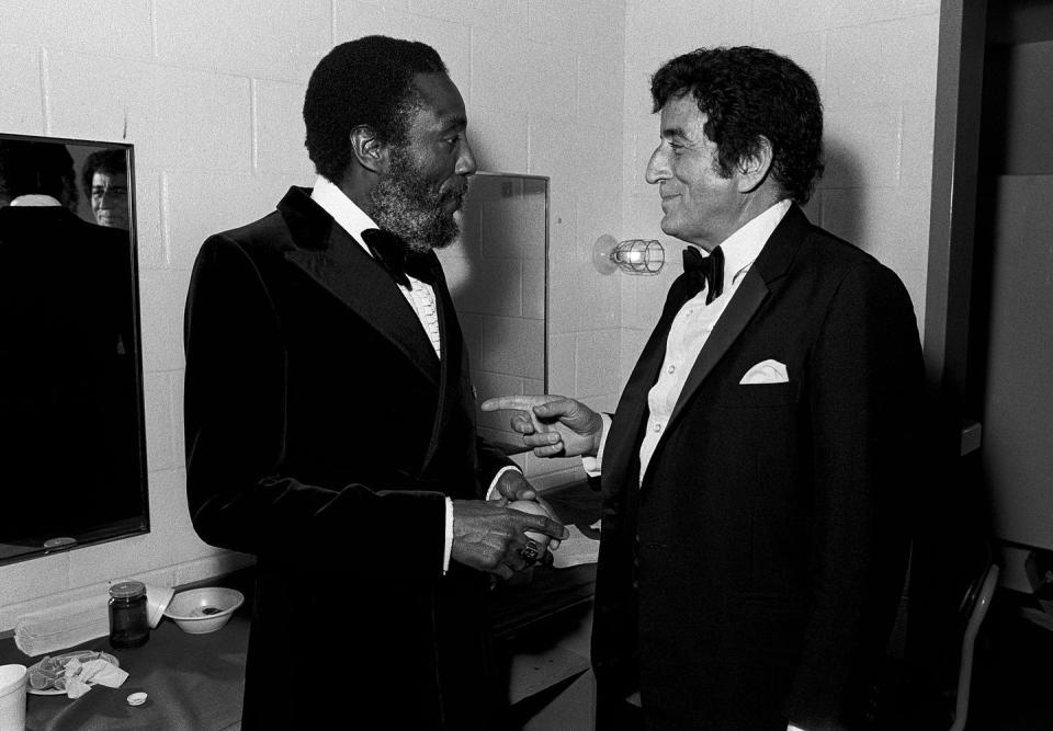 <p>Comedian Dick Gregory and singer Tony Bennett catch up backstage at the Martin Luther King Jr. Gala in Atlanta in 1982. </p>