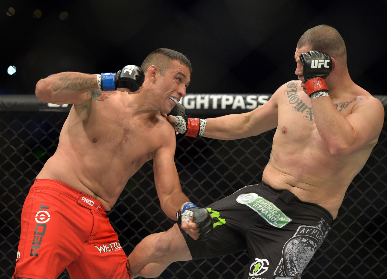 MEXICO CITY, MEXICO - JUNE 13:  (L-R) Fabricio Werdum of Brazil punches Cain Velasquez of the United States in their UFC heavyweight championship bout during the UFC 188 event inside the Arena Ciudad de Mexico on June 13, 2015 in Mexico City, Mexico. (Photo by Jeff Bottari/Zuffa LLC/Zuffa LLC via Getty Images)