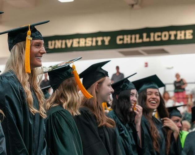 Ohio University Chillicothe graduates laugh during their graduation ceremony on May 2, 2024. Keynote Speaker Margaret Planton congratulated the graduates and reflected on the importance of Ohio University Chillicothe in her life after moving to Chillicothe in 1979 when her husband Stan became director of the Quinn Library on campus.