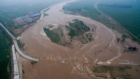 An aerial view shows that roads and fields are flooded in Xingtai, Hebei Province, China, July 21, 2016. REUTERS/Stringer