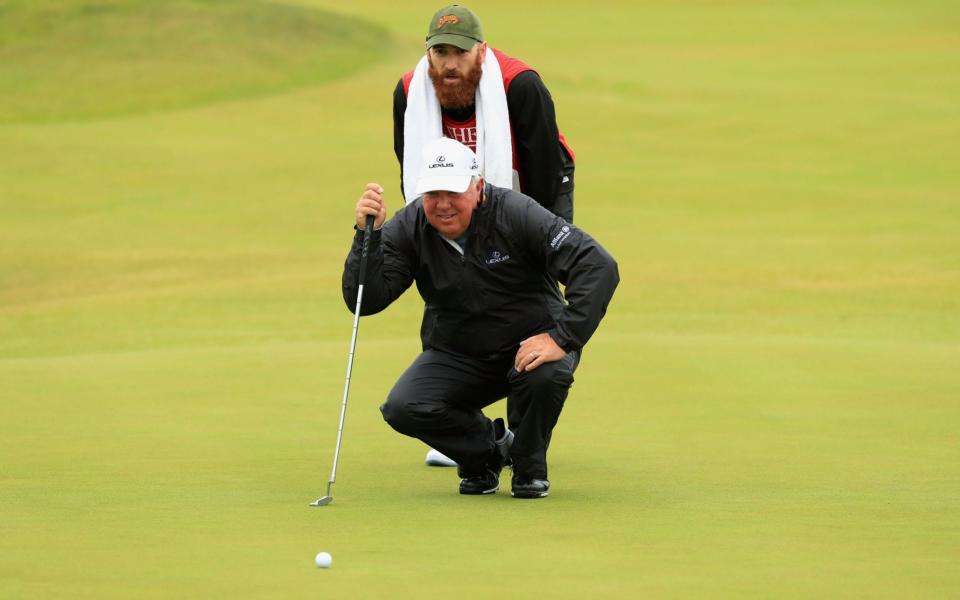 Mark O'Meara of the United States and his caddie line up a putt on the 3rd green during the first round of the 146th Open Championship at Royal Birkdale on July 20, 2017 in Southport, England - Credit:  Getty Images Europe