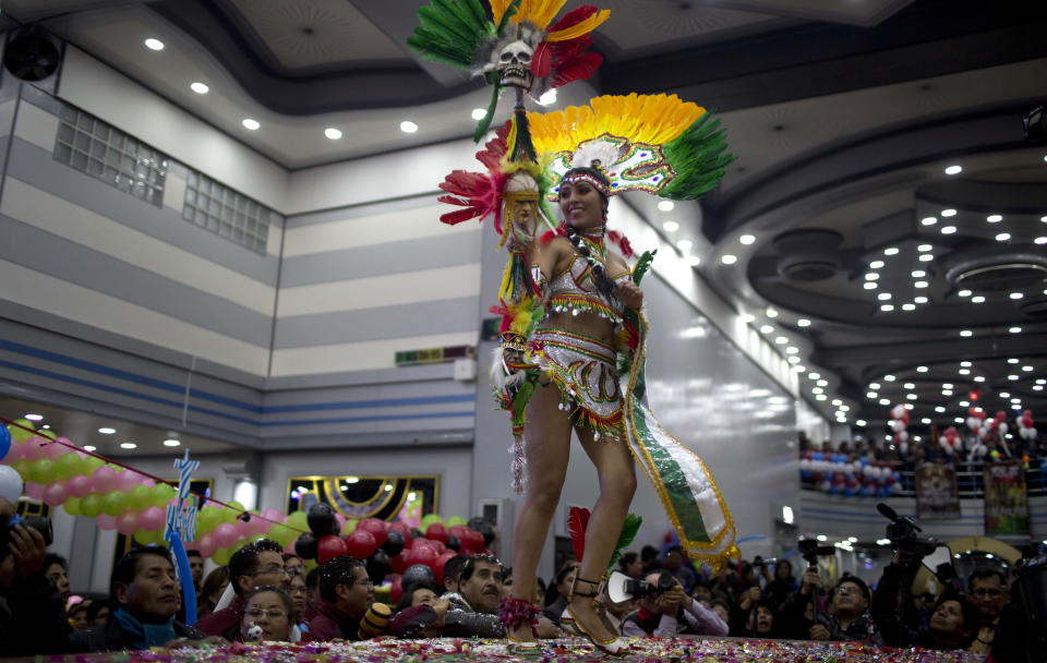A contestant performs in the contest to elect the Queen of Great Power, in La Paz, Bolivia, Friday, May 24, 2019. The contest takes place in advance of the Festival of the Lord of the Great Power, in Spanish Festividad del Senor del Gran Poder, a festivity celebrated in June since 1939 centered on a cult to an image of Jesus anonymously painted in the 17th century. (AP Photo/Juan Karita)