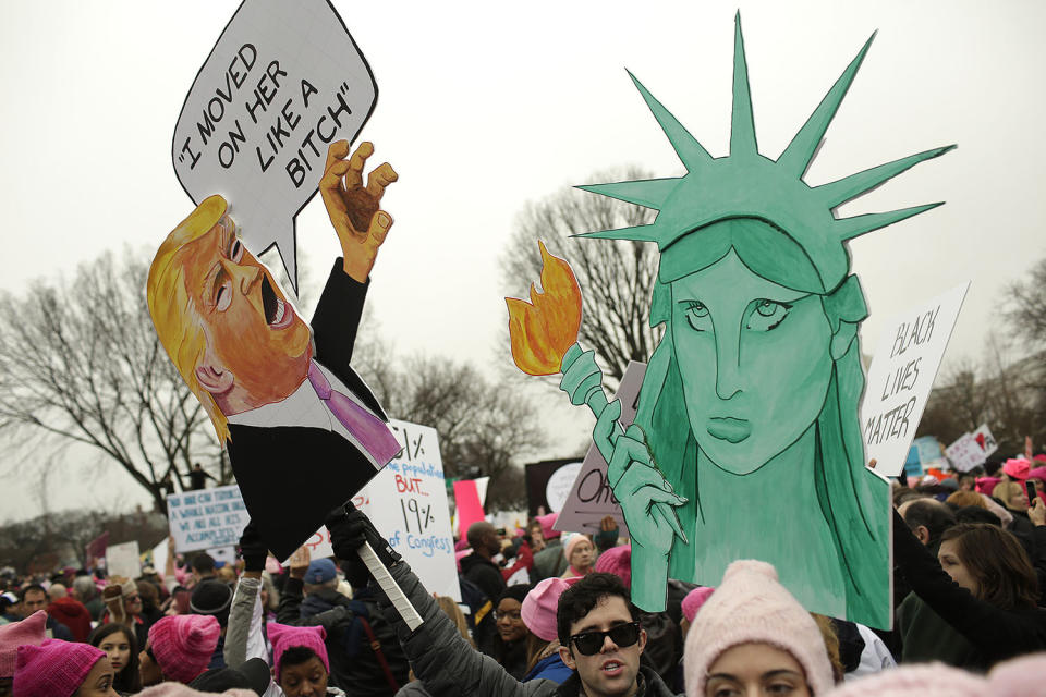 <p>Protesters display their signs in Washington, DC, during the Womens March on January 21, 2017. (JOSHUA LOTT/AFP/Getty Images) </p>