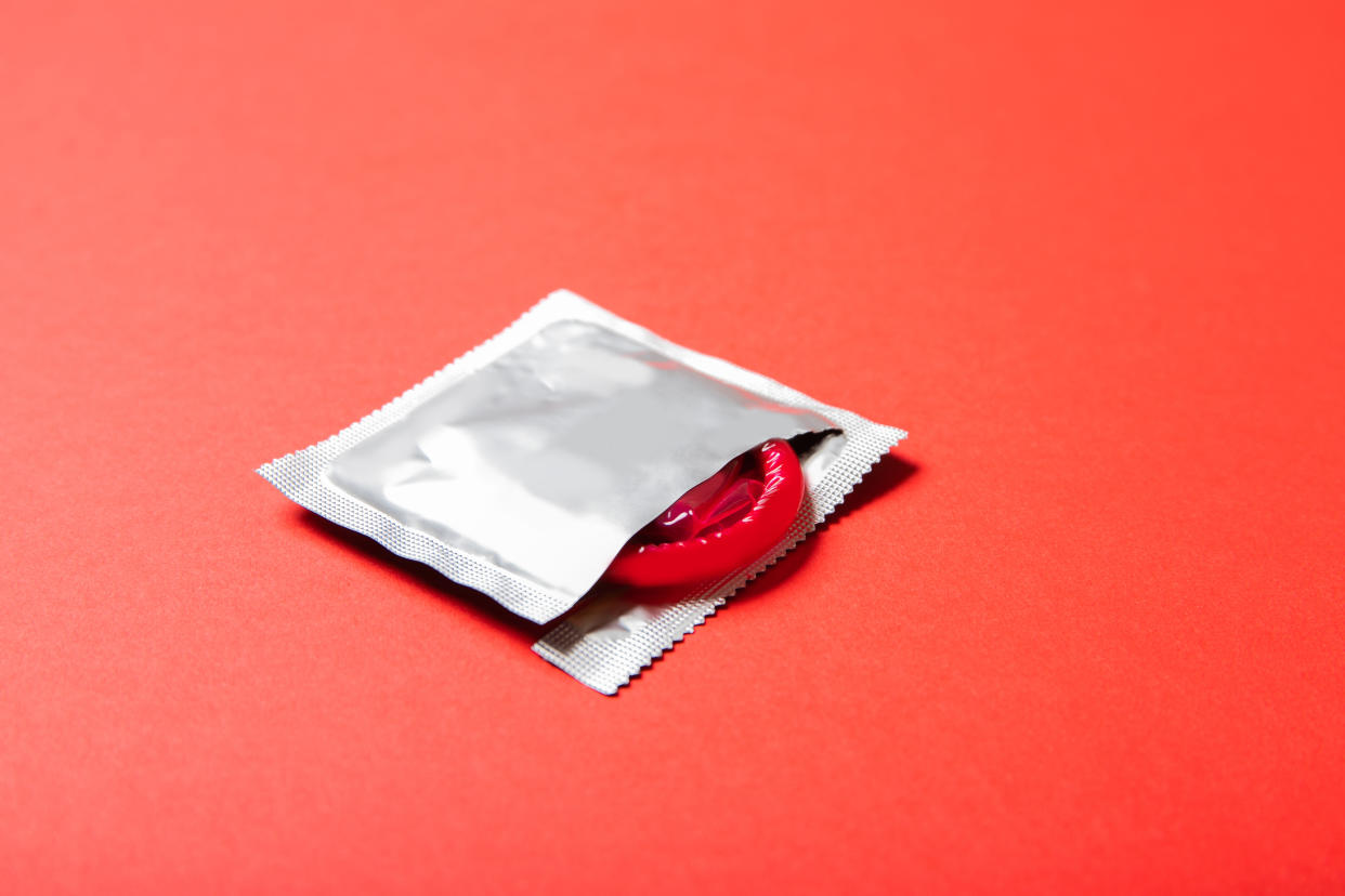 Red condom in a wrapper