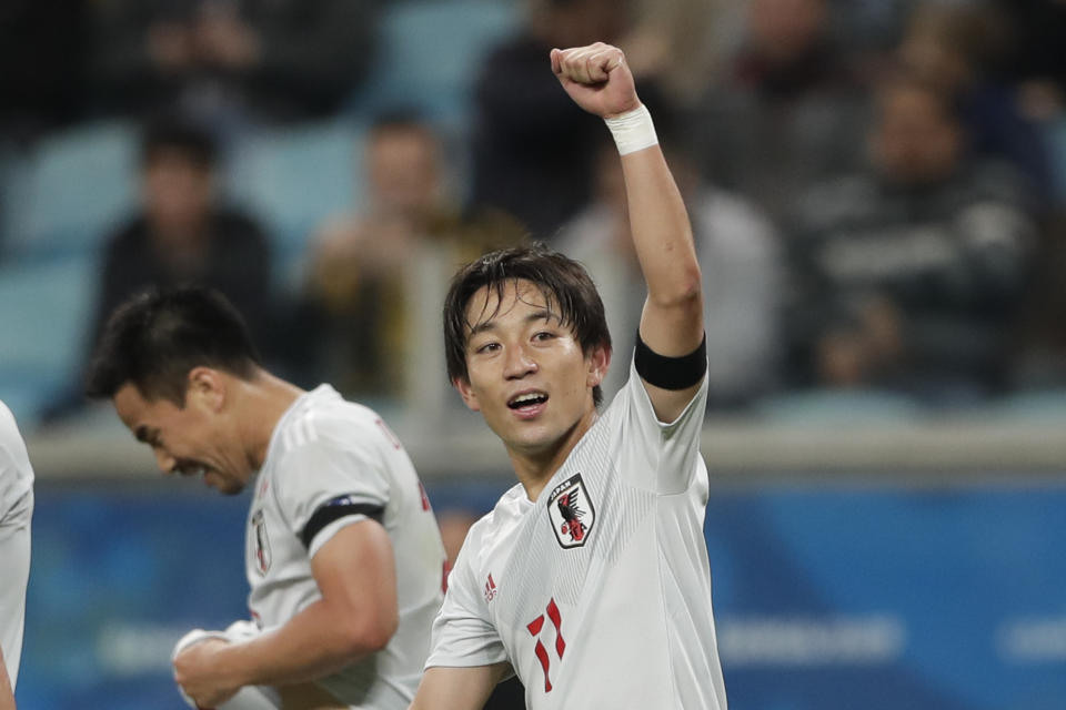 Japan's Koji Miyoshi celebrates after scoring his sides' second goal against Uruguay during a Copa America Group C soccer match at the Arena Gremio in Porto Alegre, Brazil, Thursday, June 20, 2019. (AP Photo/Silvia Izquierdo)