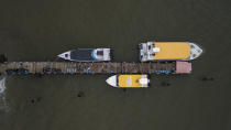 The pier where migrants leave in boats toward Capurgana to reach the Panamanian border, from Necocli, Colombia, Friday, July 30, 2021. The small city on Colombia’s Caribbean shore is being crowded with migrants from Haiti, Africa and Cuba making what they hope will be a journey toward the United States. (AP Photo/Ivan Valencia)