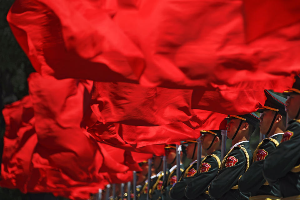 <p>Members of the honor guard hold red flags as they wait for the arrival of visiting Hungarian Prime Minister Viktor Orban during a welcome ceremony outside the Great Hall of the People in Beijing, May 13, 2017. Orban is in Beijing to attend the Belt and Road Forum on May 14-15. (Photo: Andy Wong/AP) </p>