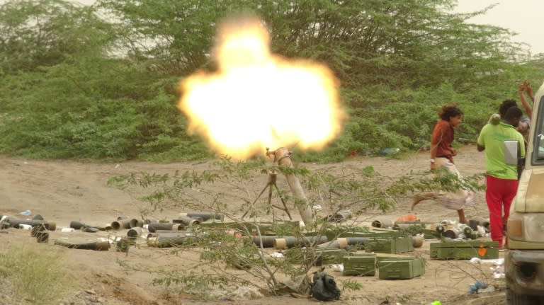 A file picture shows Yemeni pro-government forces firing a mortar round in the area of al-Fazah in Yemen's Hodeida province on June 15, 2018