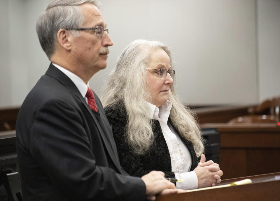 Kathy Funk and her attorney Philip H. Beauvais III appear in court, Wednesday, Jan. 25, 2023, in Flint, Mich. Funk, who was a public official in a Flint-area community admitted, Wednesday that she broke a seal on a ballot box to ensure that votes could not be recounted in her 2020 race, prosecutors said Brice Tucker. Funk, 59, pleaded no contest to misconduct in office, a felony, under an agreement that includes no time in jail. (Brice Tucker/The Flint Journal via AP)