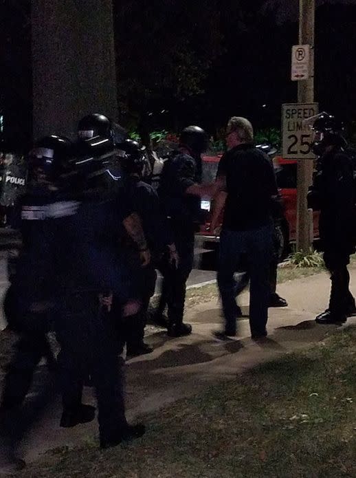 Rev. Gary James speaks&nbsp;to&nbsp;police in St. Louis Friday night. (Photo: Lynn Hunt)