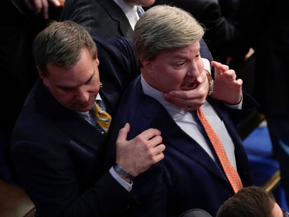 Rep. Richard Hudson, R-N.C., left, pulls Rep. Mike Rogers, R-Ala., back as they talk with Rep. Matt Gaetz, R-Fla. during the 14th round of voting for speaker as the House on Friday, Jan. 6, 2023.