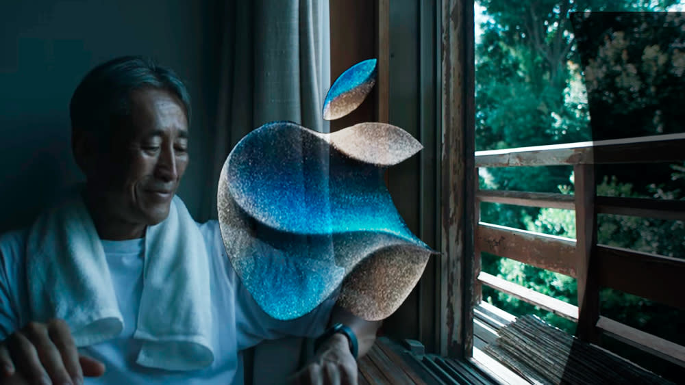  An image of the Apple logo over a still from the Apple Wonderlust event. 