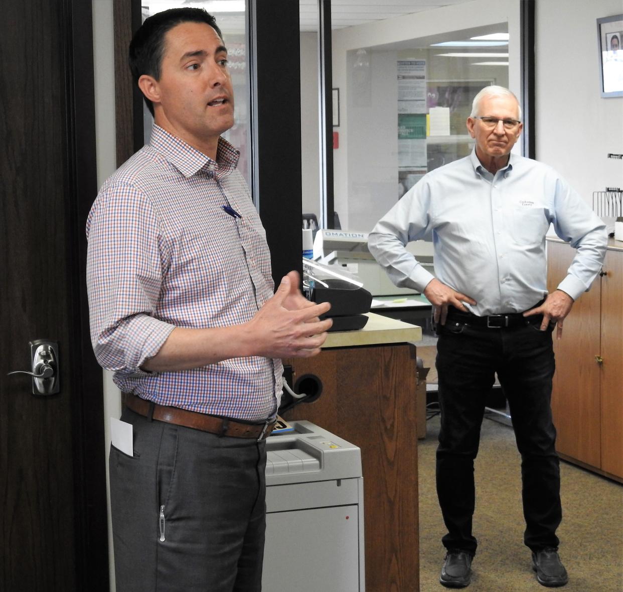 Ohio Secretary of State Frank LaRose speaks while Commissioner Dane Shryock listens on Tuesday at the Coshocton County Board of Elections. LaRose made a routine stop to see if the board was ready for the May 3 primary.