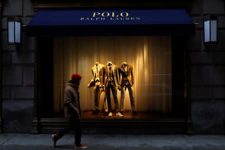A man walks past Ralph Lauren Corp.'s flagship Polo store on Fifth Avenue in New York