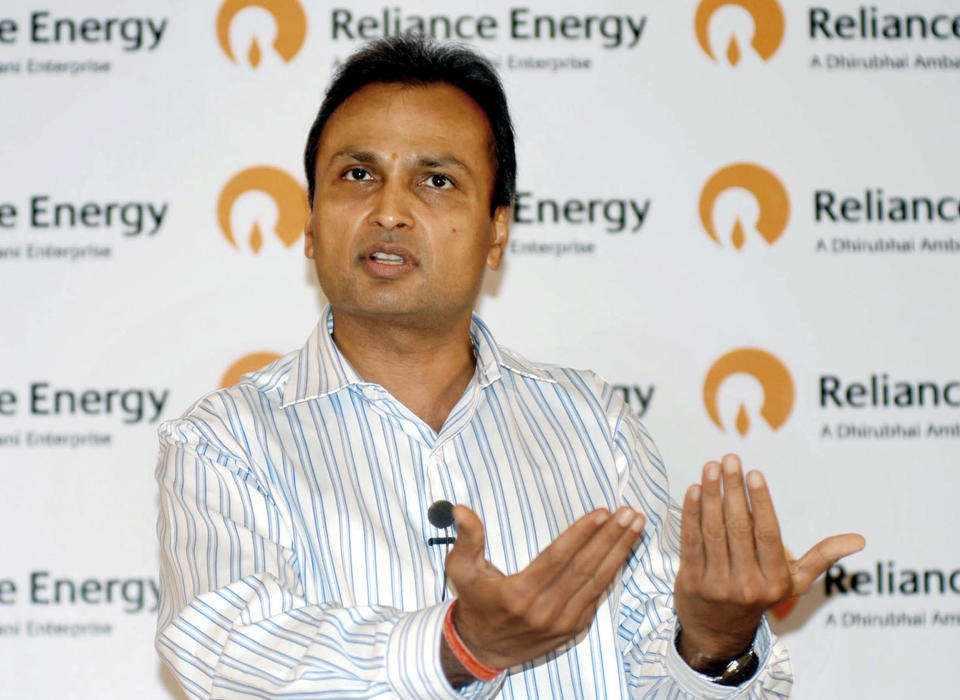 Reliance Energy Chairman Anil Ambani gestures as he announces an Indian Rupees one billion (22,988,505 USD) disaster management plan to focus on safety, reliability, backup and standby of network, in Mumbai 02 August 2005. Ambani assured Reliance Energy's 20,000-odd customers in Kurla, Saki Naka and Kalina, Mumbai's worst flood-hit areas, that they would be provided with power in the next 24 to 48 hours with the replacement of some 90 transformers which broke down during the unprecedented rains in Mumbai last week. AFP PHOTO
