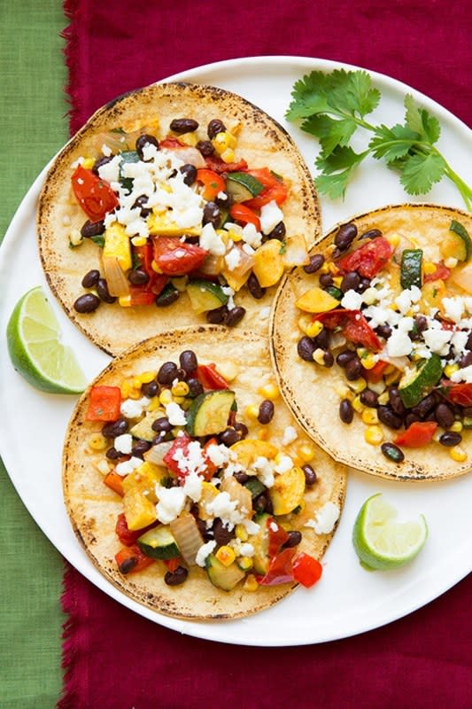 <p>Cooking Classy</p><p>Make your next Taco Tuesday a meat-free one with these tasty vegetarian tacos with black beans, squash, corn and more roasted veggies. </p><p><strong>Cost: $15.61</strong></p><p><strong>Get the recipe: <a href="https://www.cookingclassy.com/roasted-veggie-black-bean-tacos/" rel="nofollow noopener" target="_blank" data-ylk="slk:Roasted Veggie and Black Bean Tacos;elm:context_link;itc:0;sec:content-canvas" class="link rapid-noclick-resp">Roasted Veggie and Black Bean Tacos</a></strong></p>